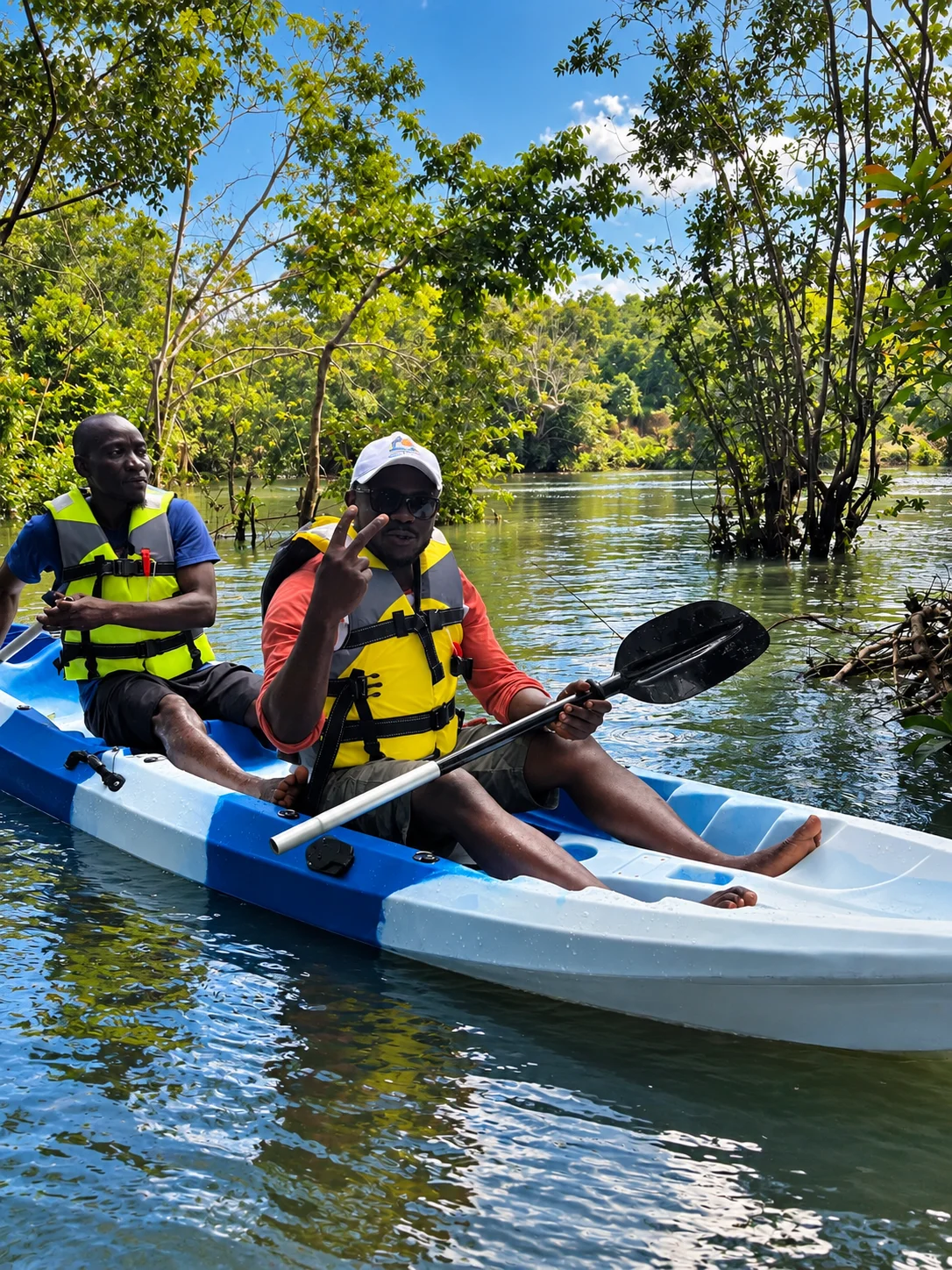 Visitors wearing life jackets on the river at Bush Garden